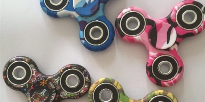 Spinner with tactical pattern